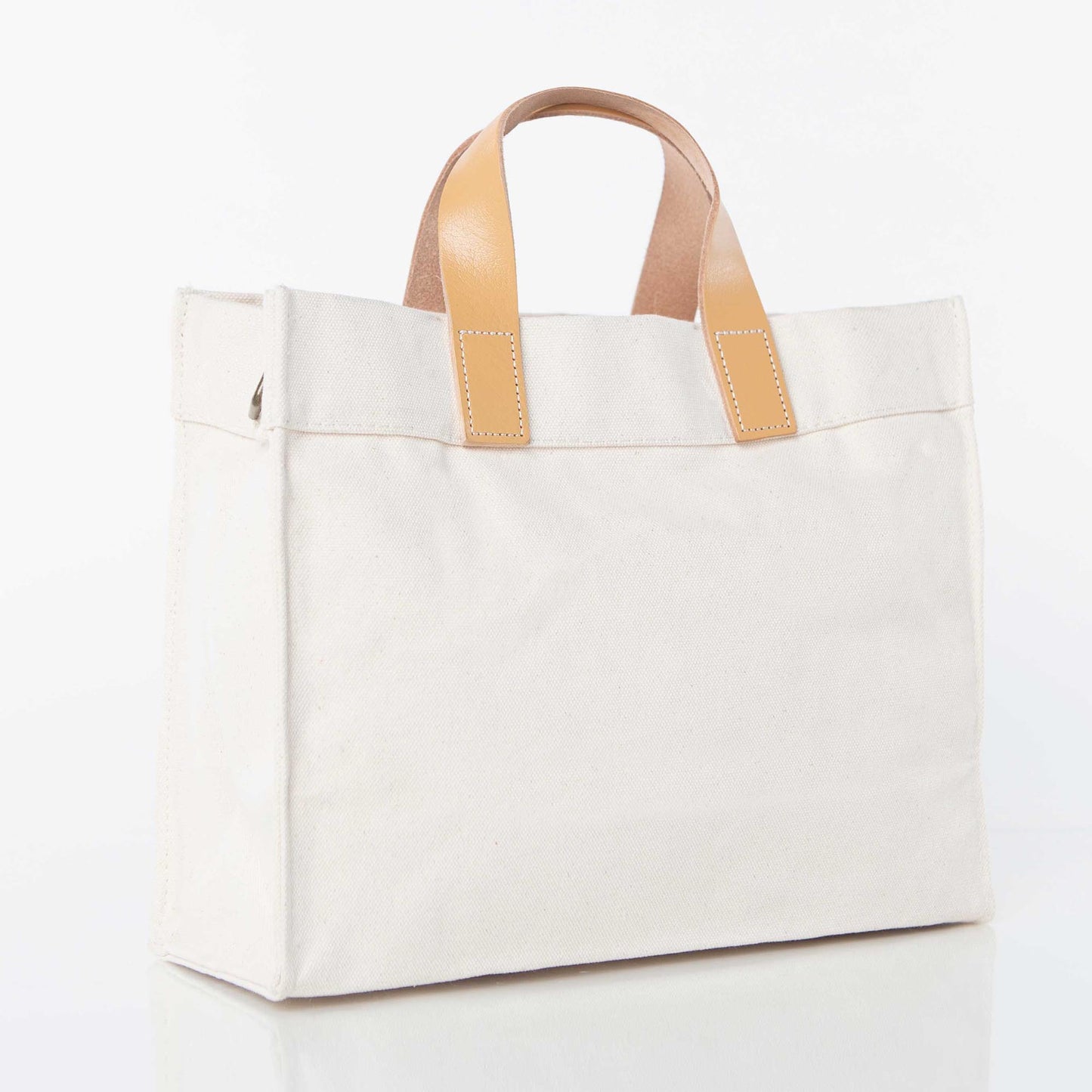 White Canvas Utility Bag with Brown Leather Handles & Adjustable Strap