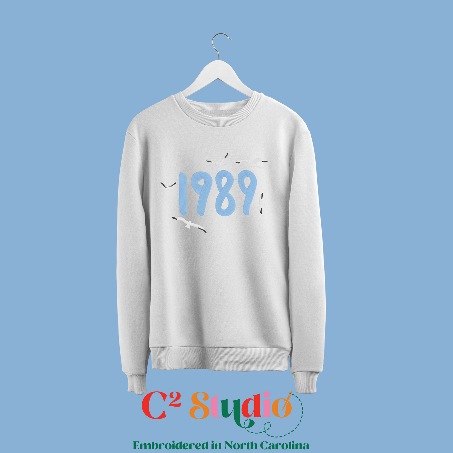 White crewneck Sweatshirt mockup with '1989' text and seagulls design