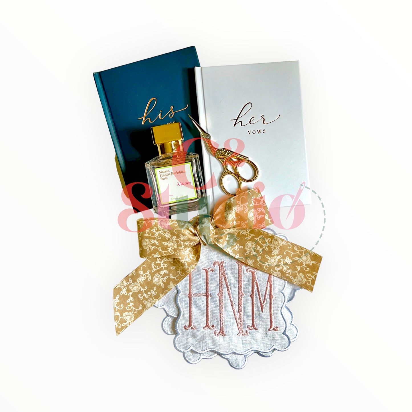 A set of White Linen Scalloped Edge Cocktail Napkins with embroidered "HNM" monogram, surrounded by wedding items