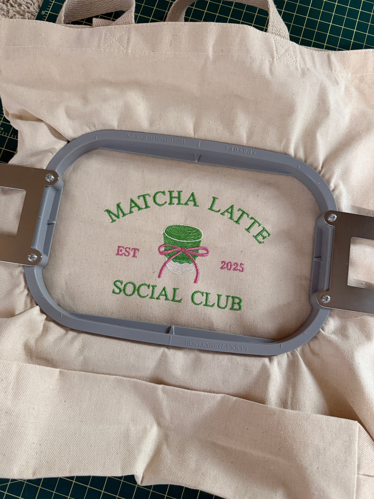 Close-up of embroidered 'Matcha Latte Social Club EST 2025' text and logo on tote bag