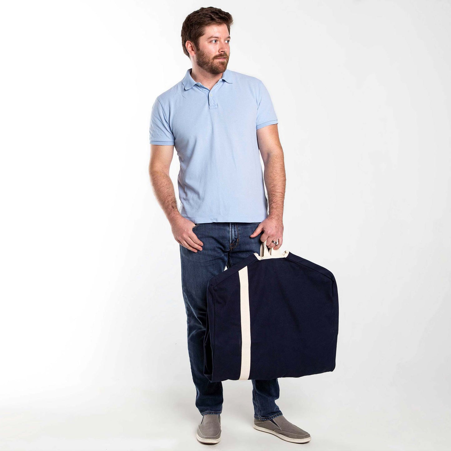 Model holding a navy blue and white Heavy Duty Garment Bag
