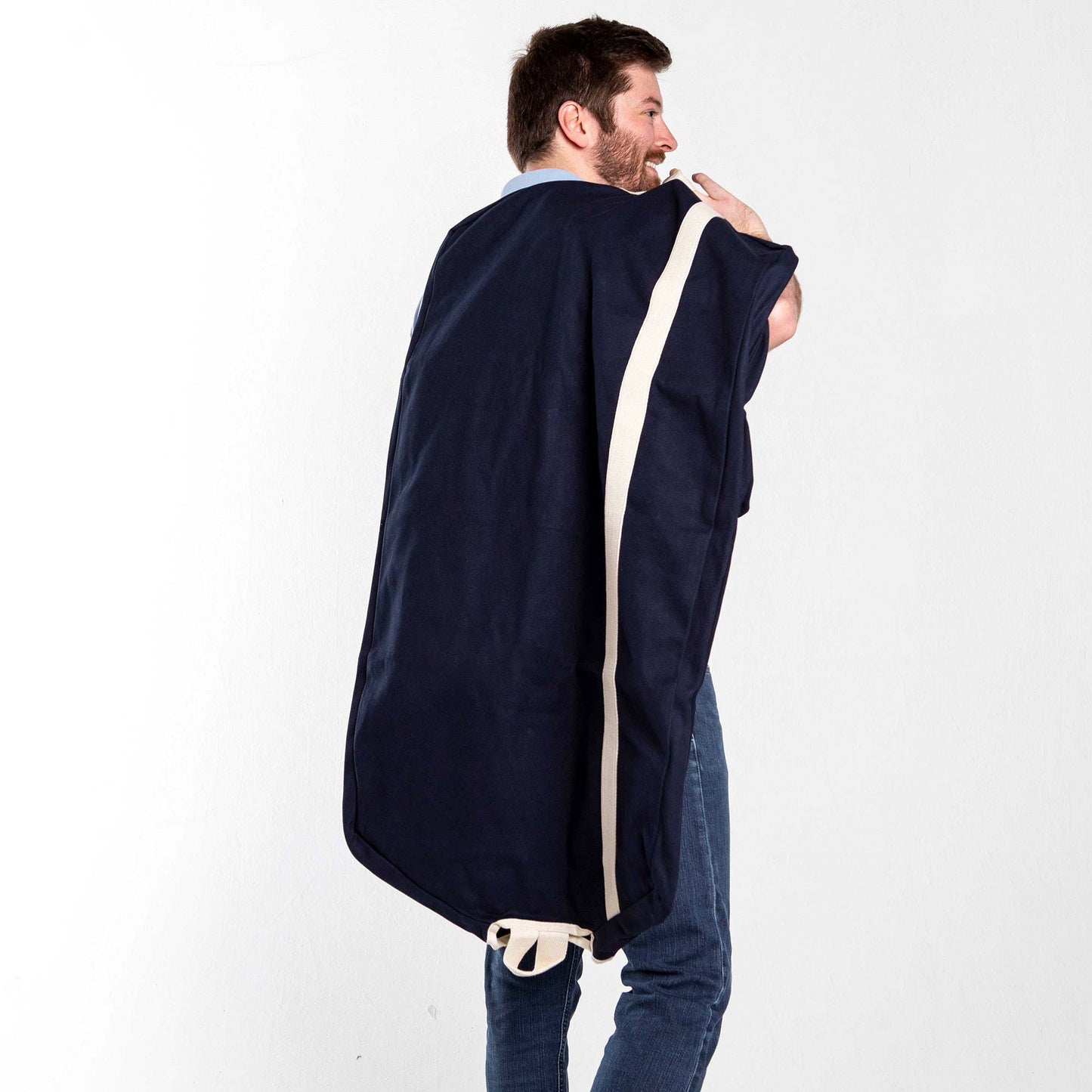 Person carrying a Navy blue and white Heavy Duty Garment Bag