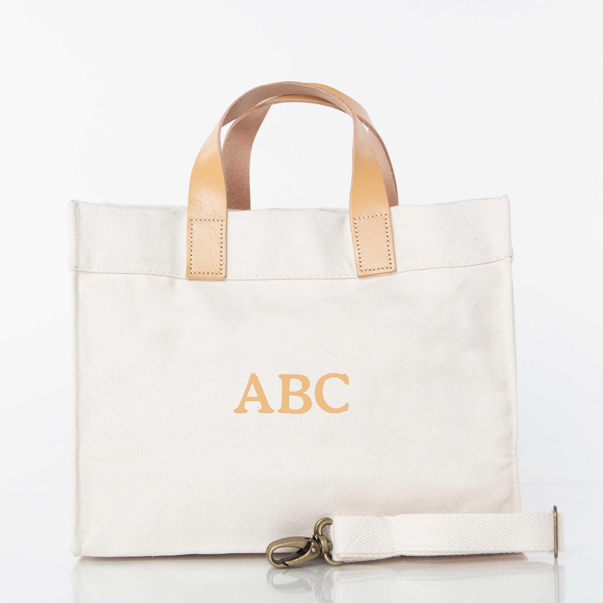White Leather Strap Canvas Tote with Brown Handles and embroidered "ABC" Monogram