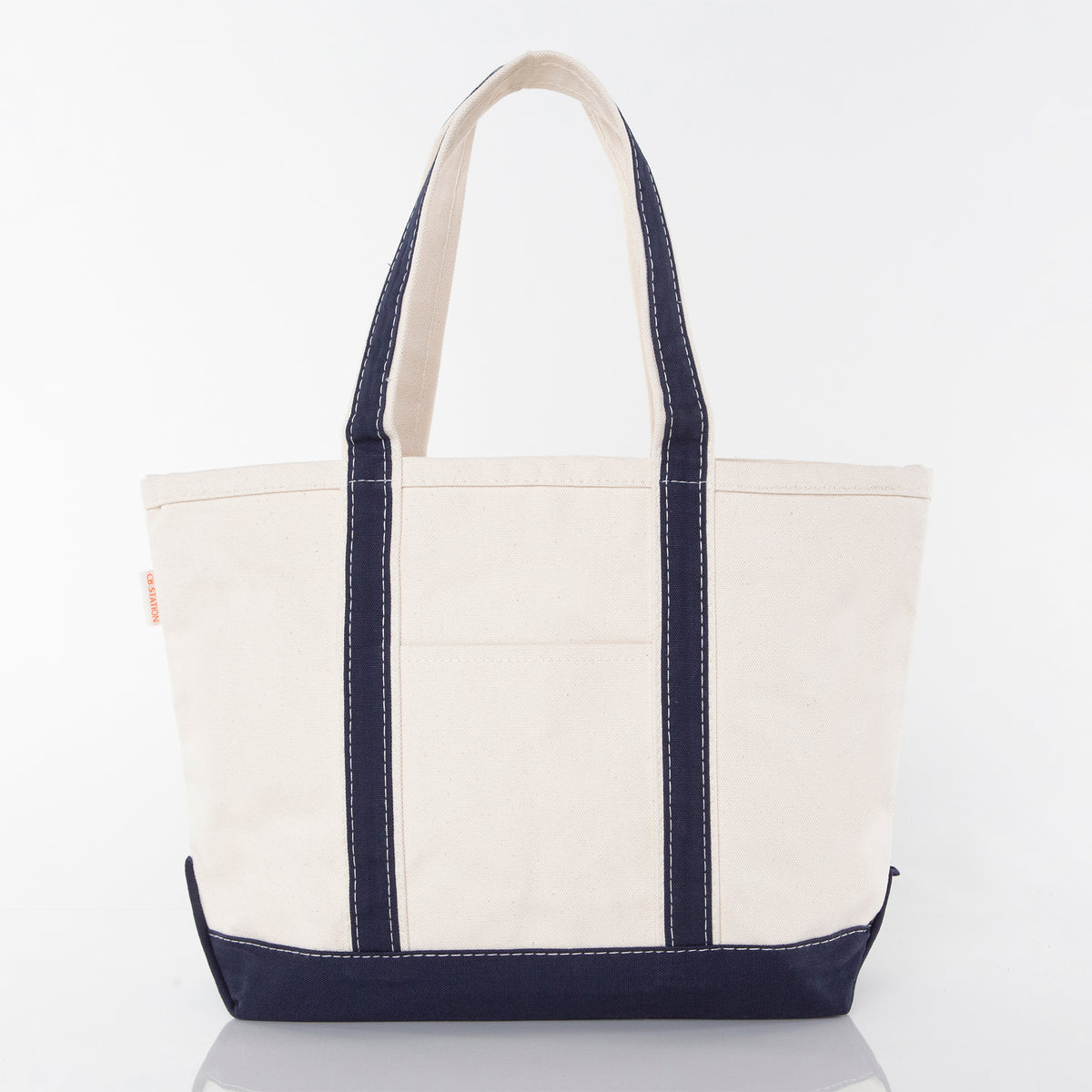 Front side of a white tote bag sample with navy handles